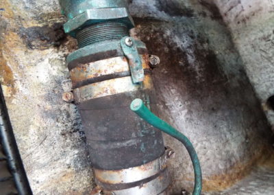 Bonding wire on sailboat engine shaft log is corroded and detached- hose clamps also corroded