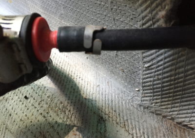 Marine surveyor finds gasoline boat fuel primer bulb not attached properly to fuel hose, spring clamp incorrectly positioned